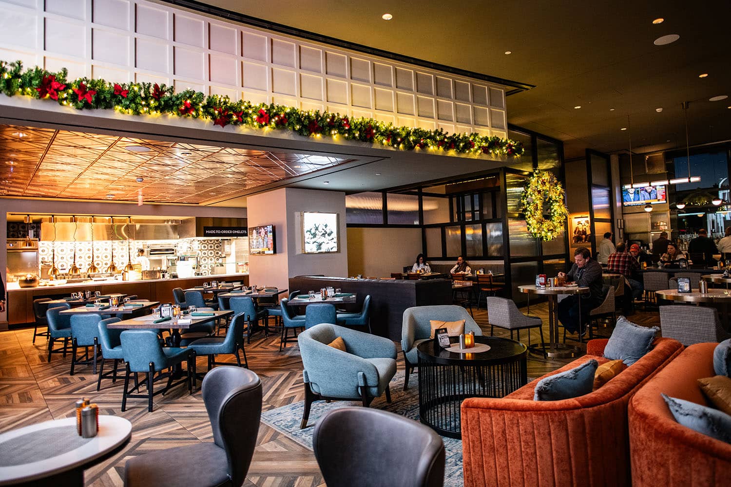 An elegantly decorated hotel lobby with white lights and garland