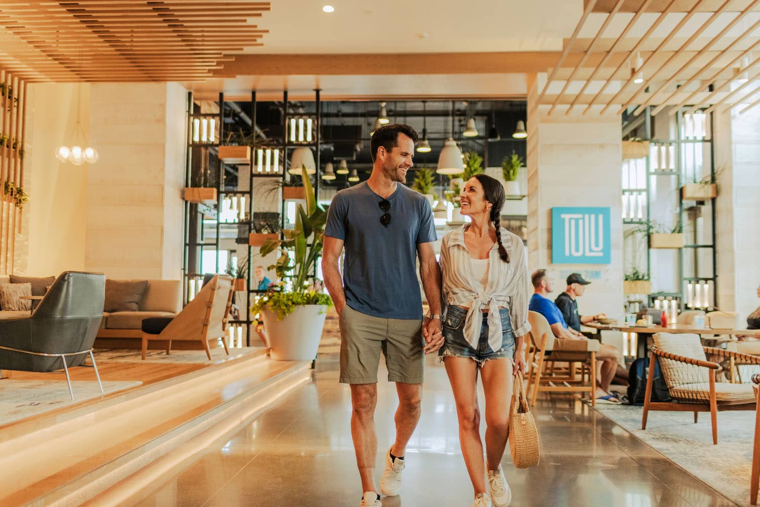 A couple walking out of Tulu Restaurant