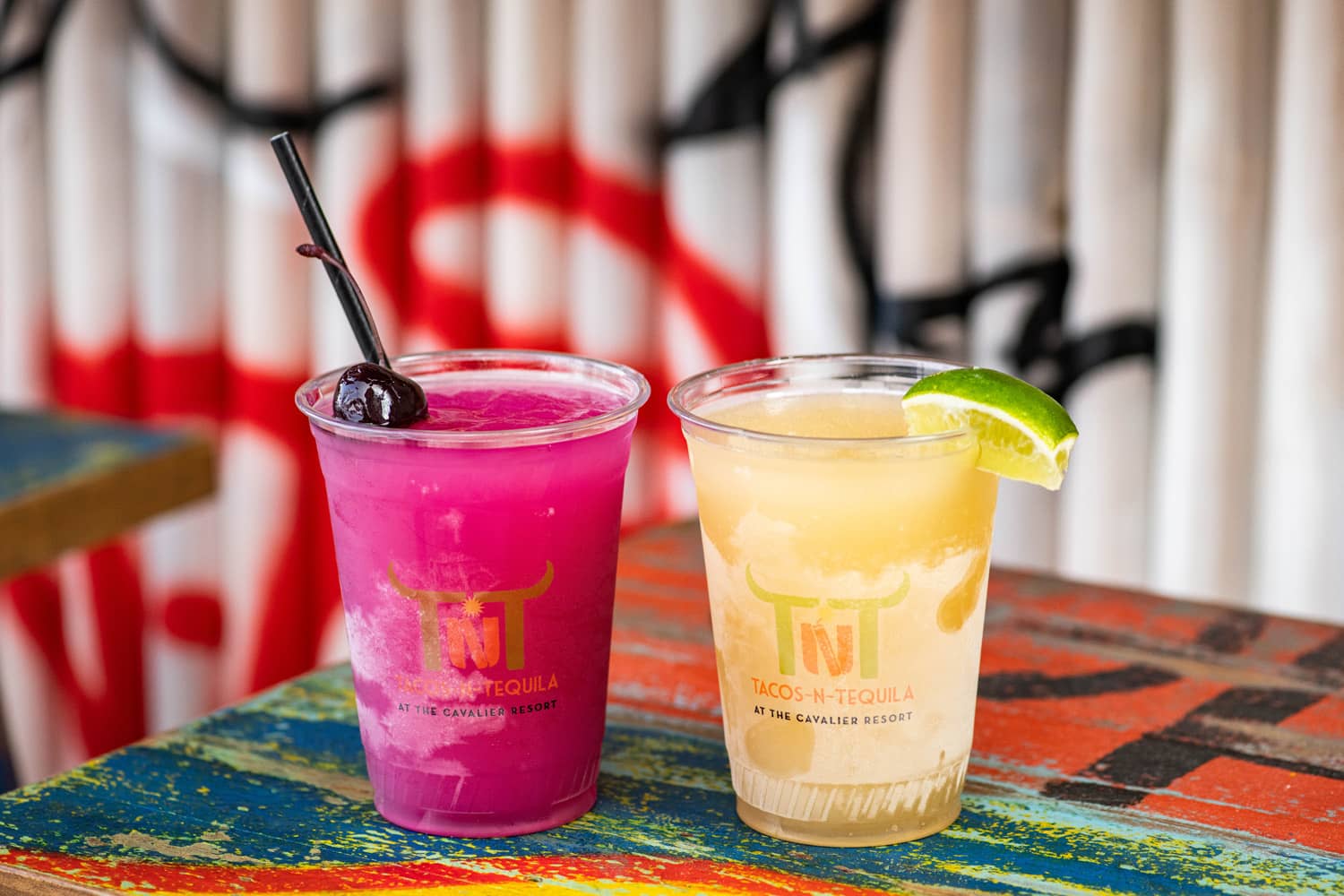A pair of frozen margarita drinks on a table