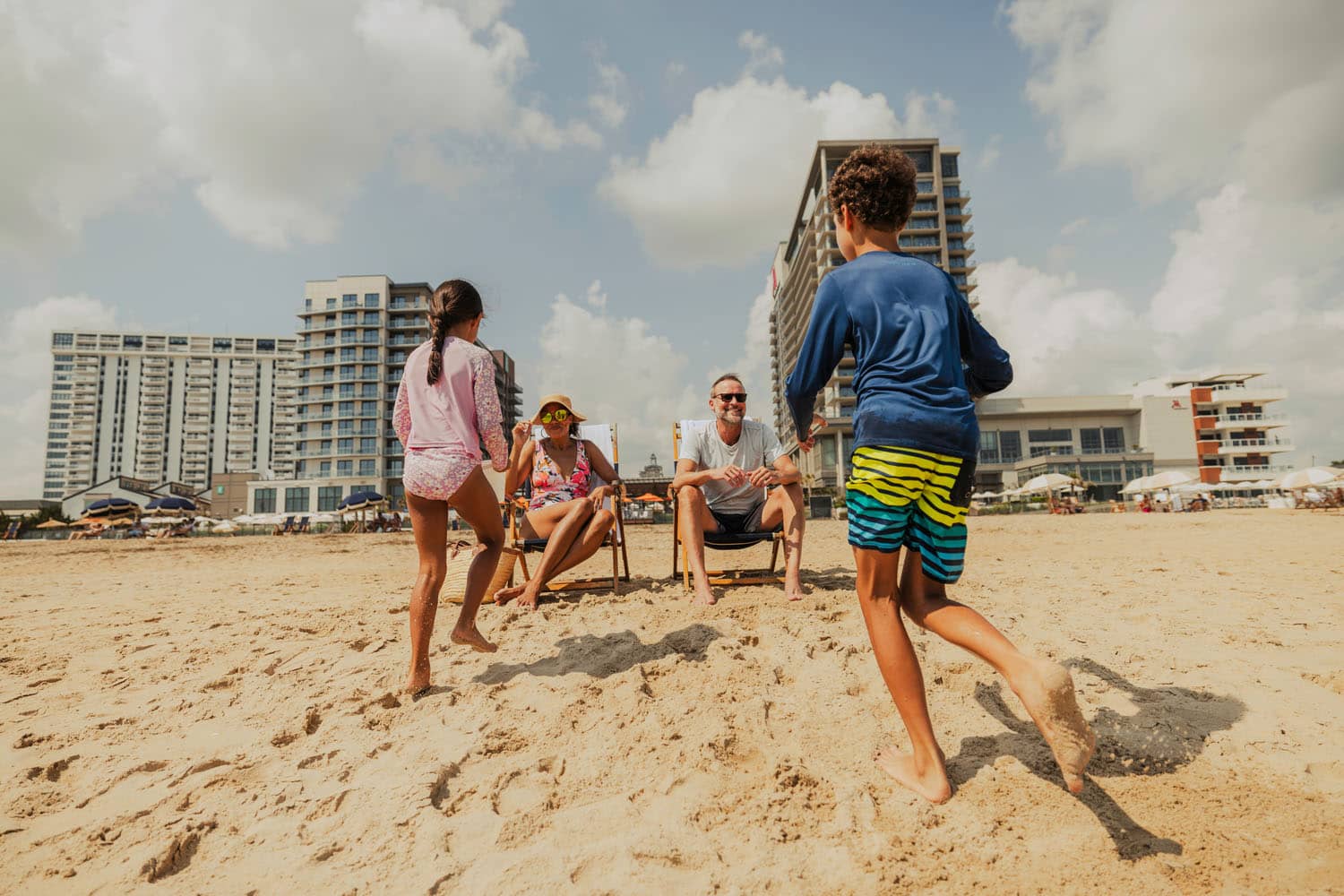 A family on the beach at the Cavalier Resort