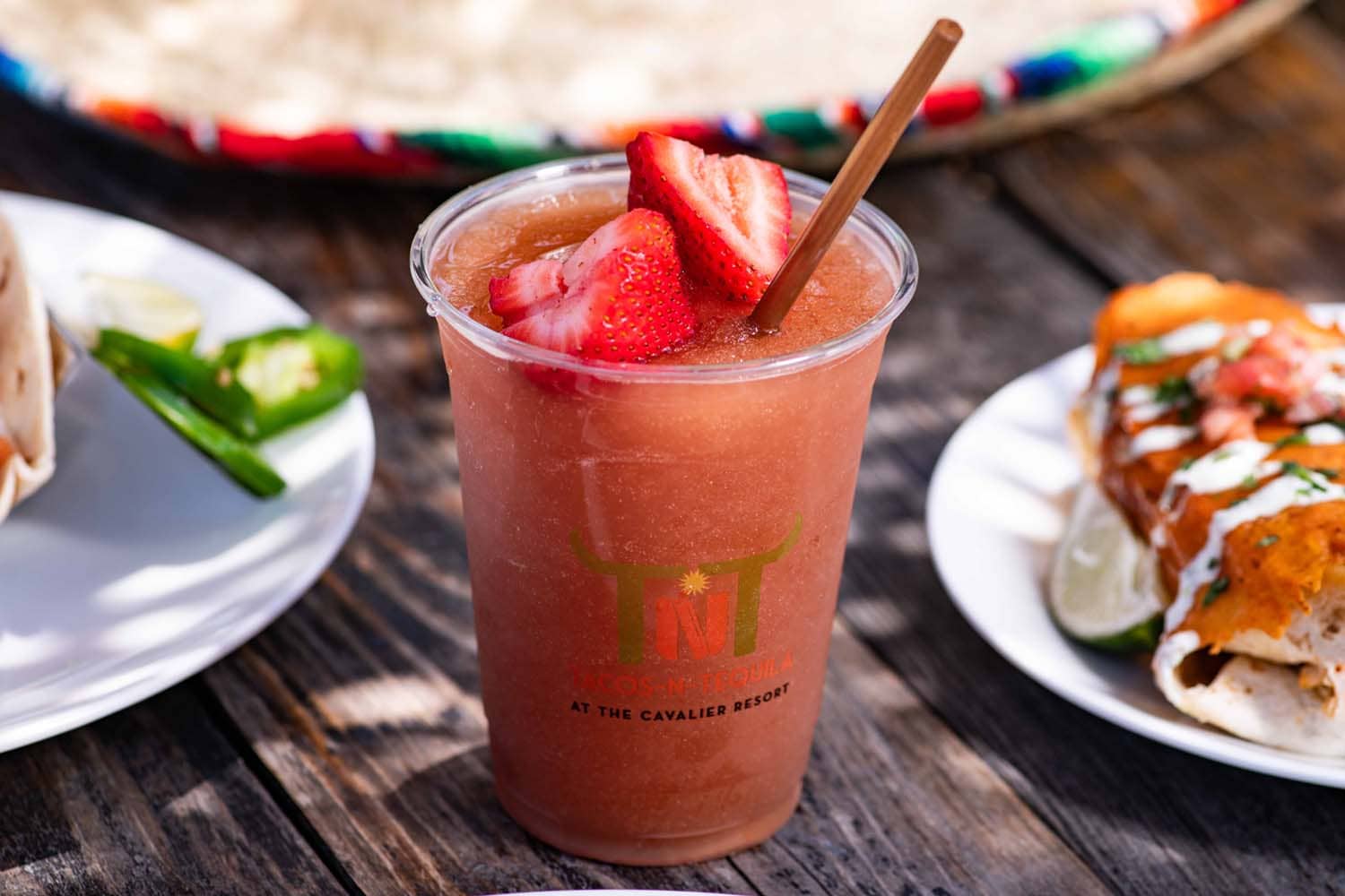 A frozen strawberry margarita on a table at Tacos-N-Tequila restaurant