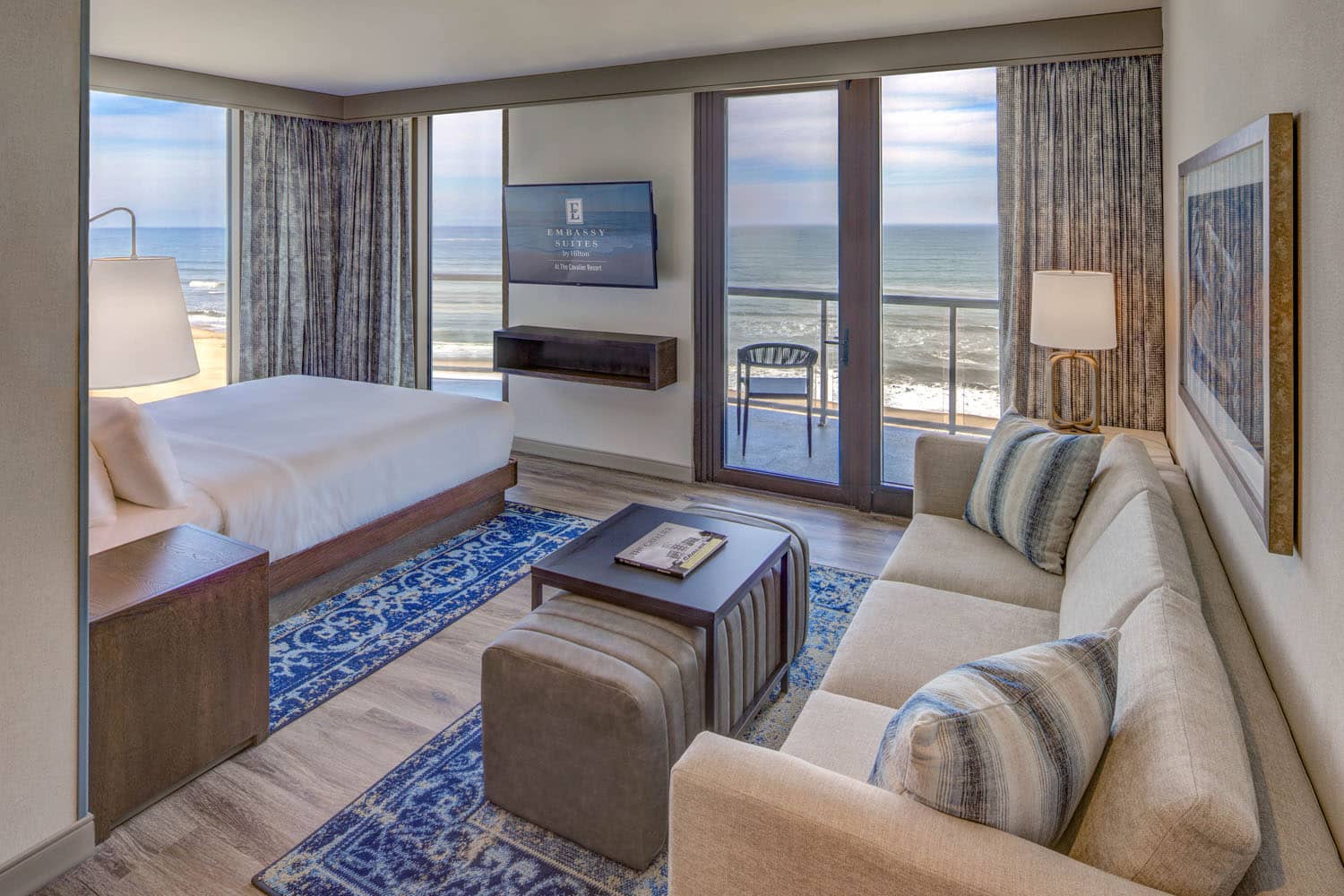 A king oceanfront studio suite inside the Embassy Suites Virginia Beach Oceanfront Resort