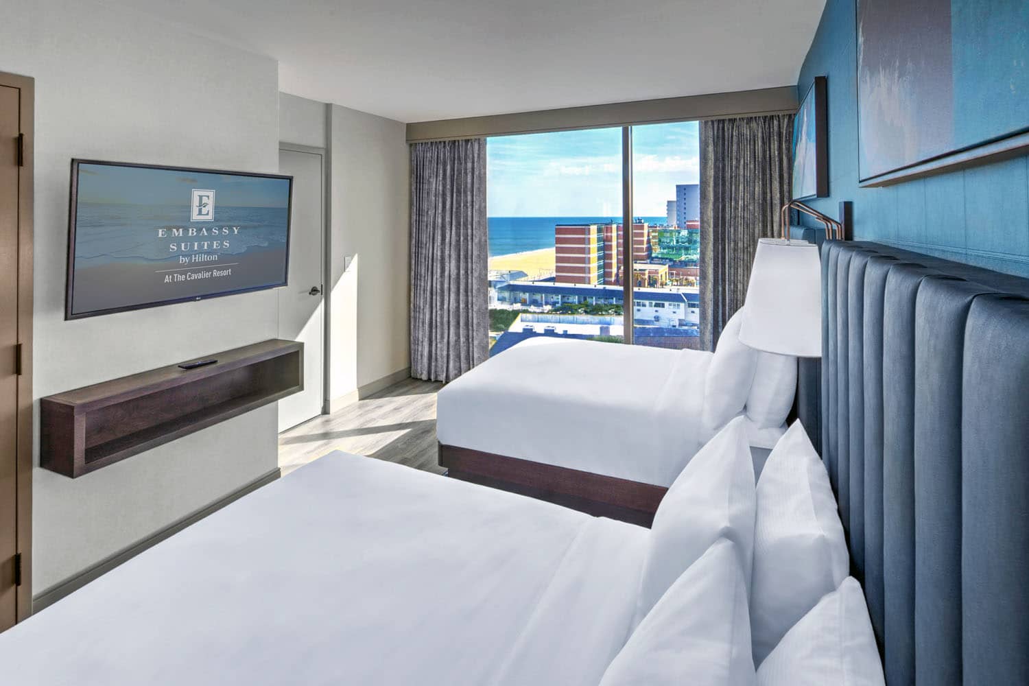 A two queen, two-room suite inside the Embassy Suites Virginia Beach Oceanfront Resort