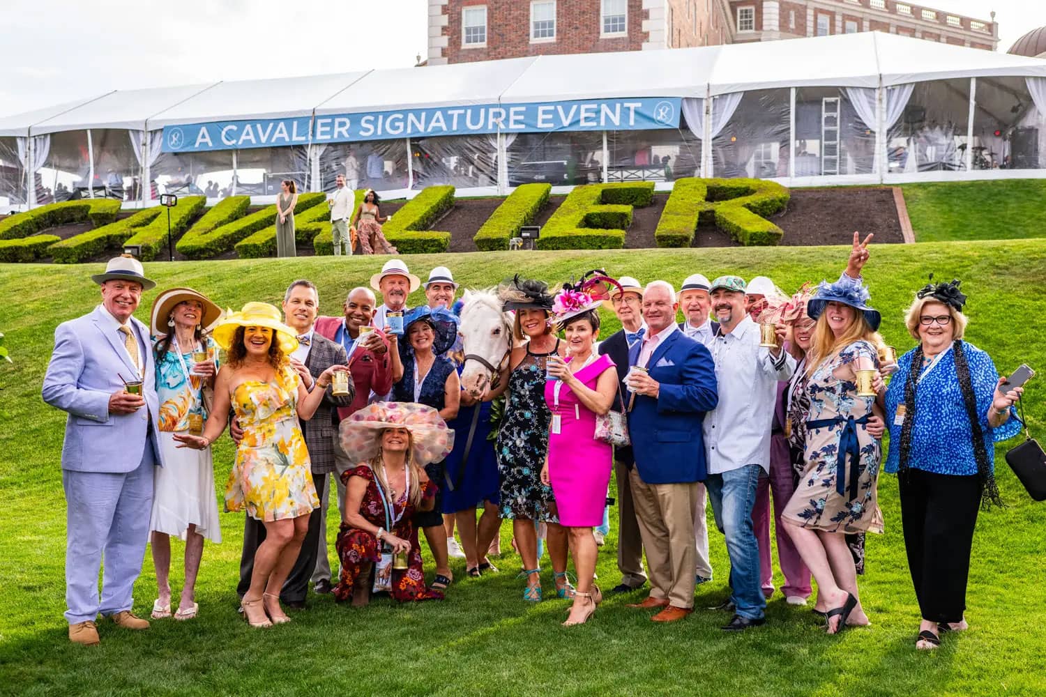 A group of people posing for a photo at an outdoor event