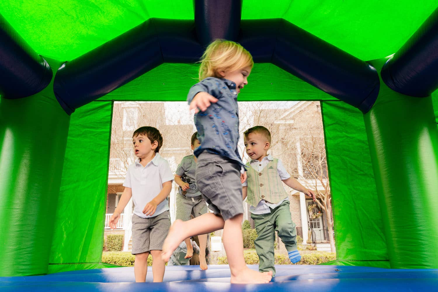 Children playing in a bounce house on The Historic Cavalier Great Lawn