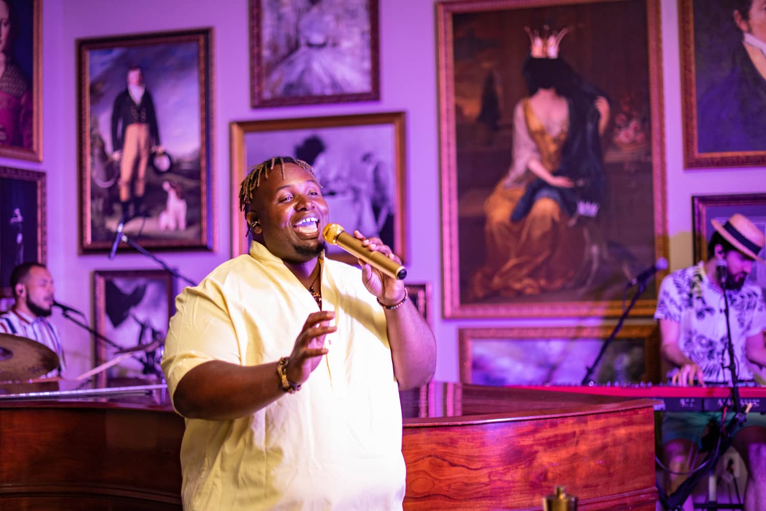 An artist singing a song inside a lounge at The Historic Cavalier Hotel