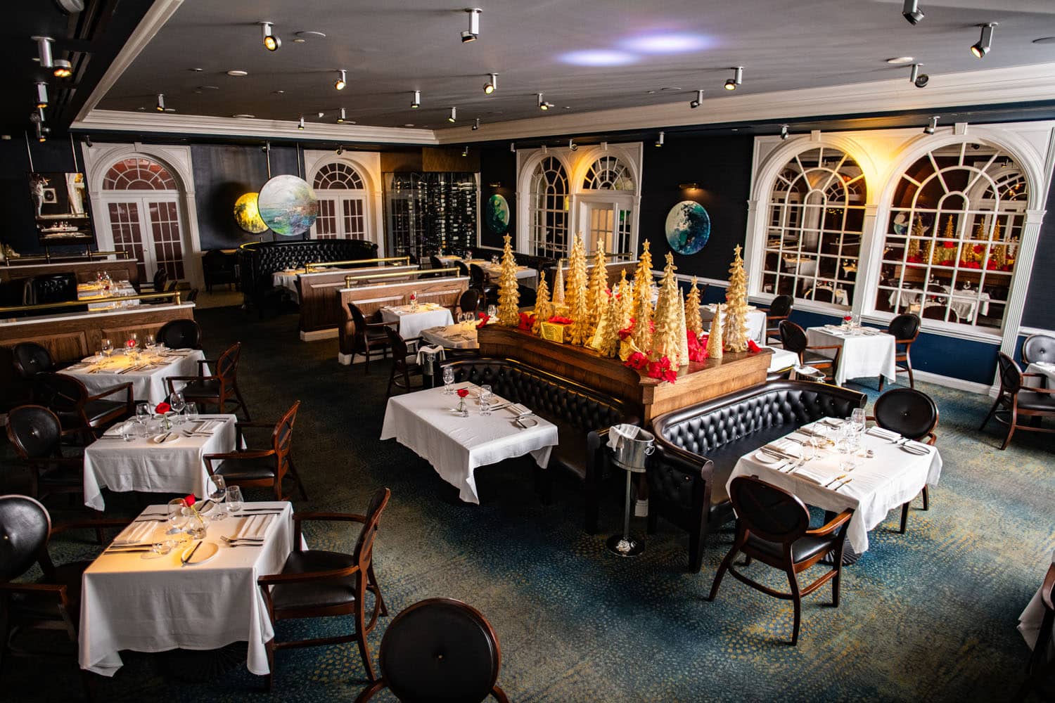 A holiday decorated dining room inside a restaurant