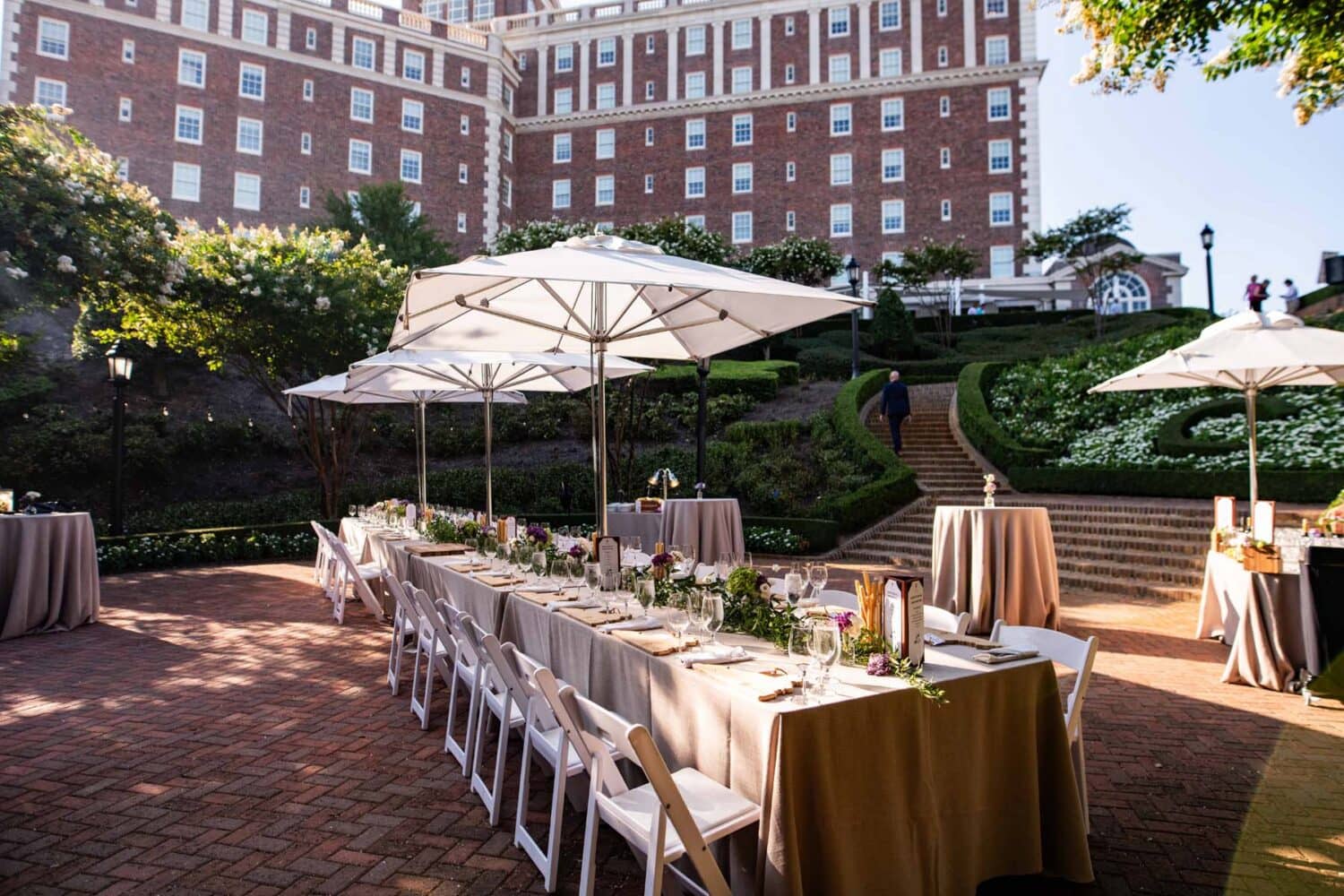 A special event with a decorated table outside near a garden