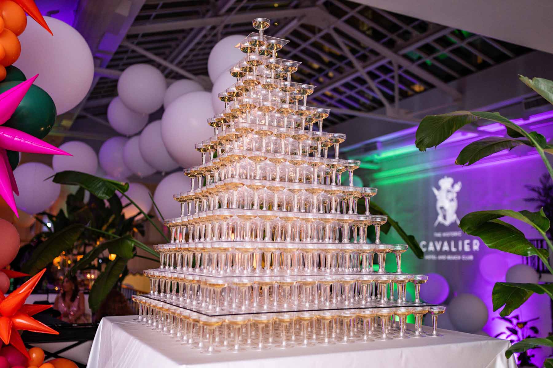 A tower of champagne glasses during a New Year's Eve party