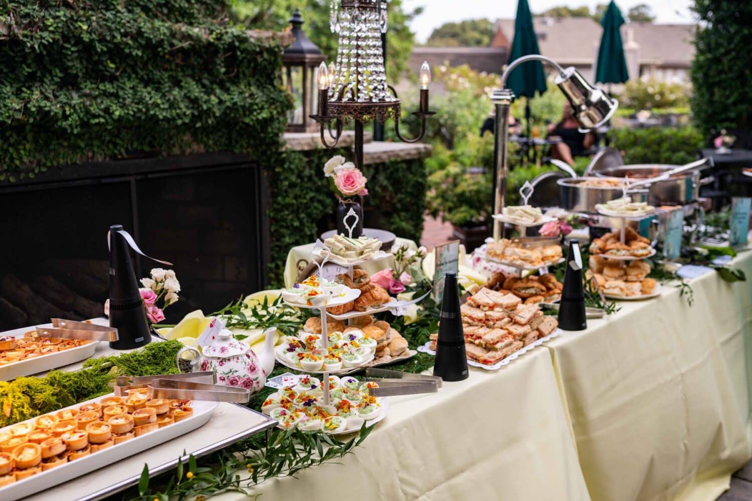 An event table decorated with food outside The Historic Cavalier Hotel