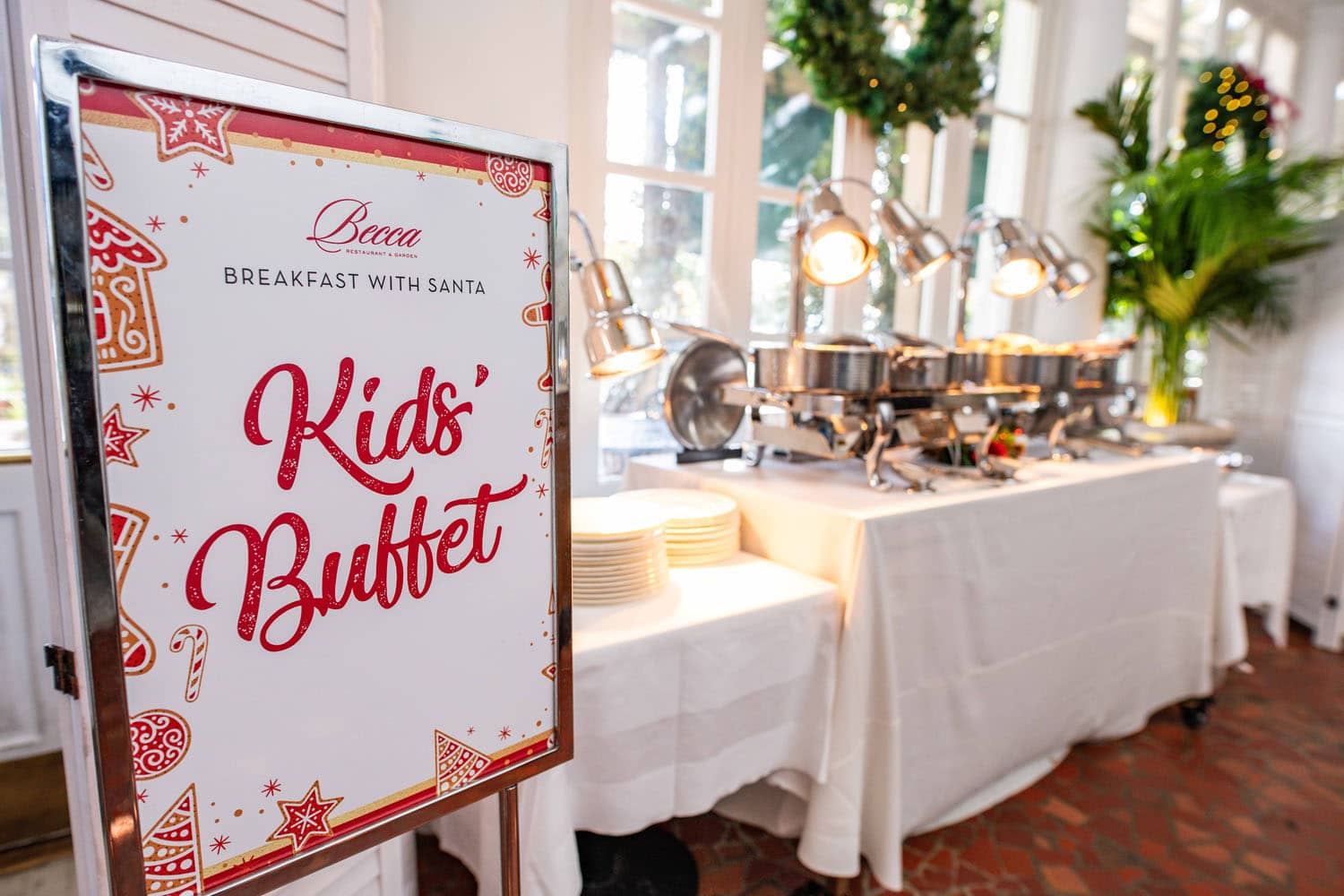 A kid's buffet table and sign inside a restaurant