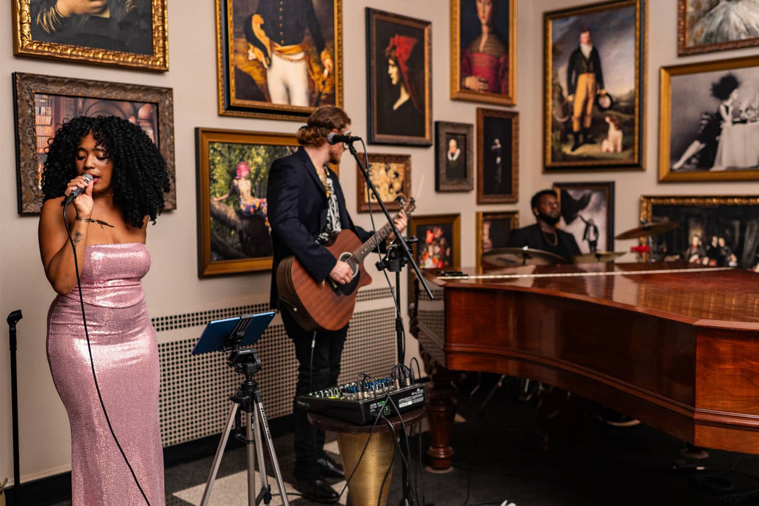 An artist singing live songs inside The Raleigh Room