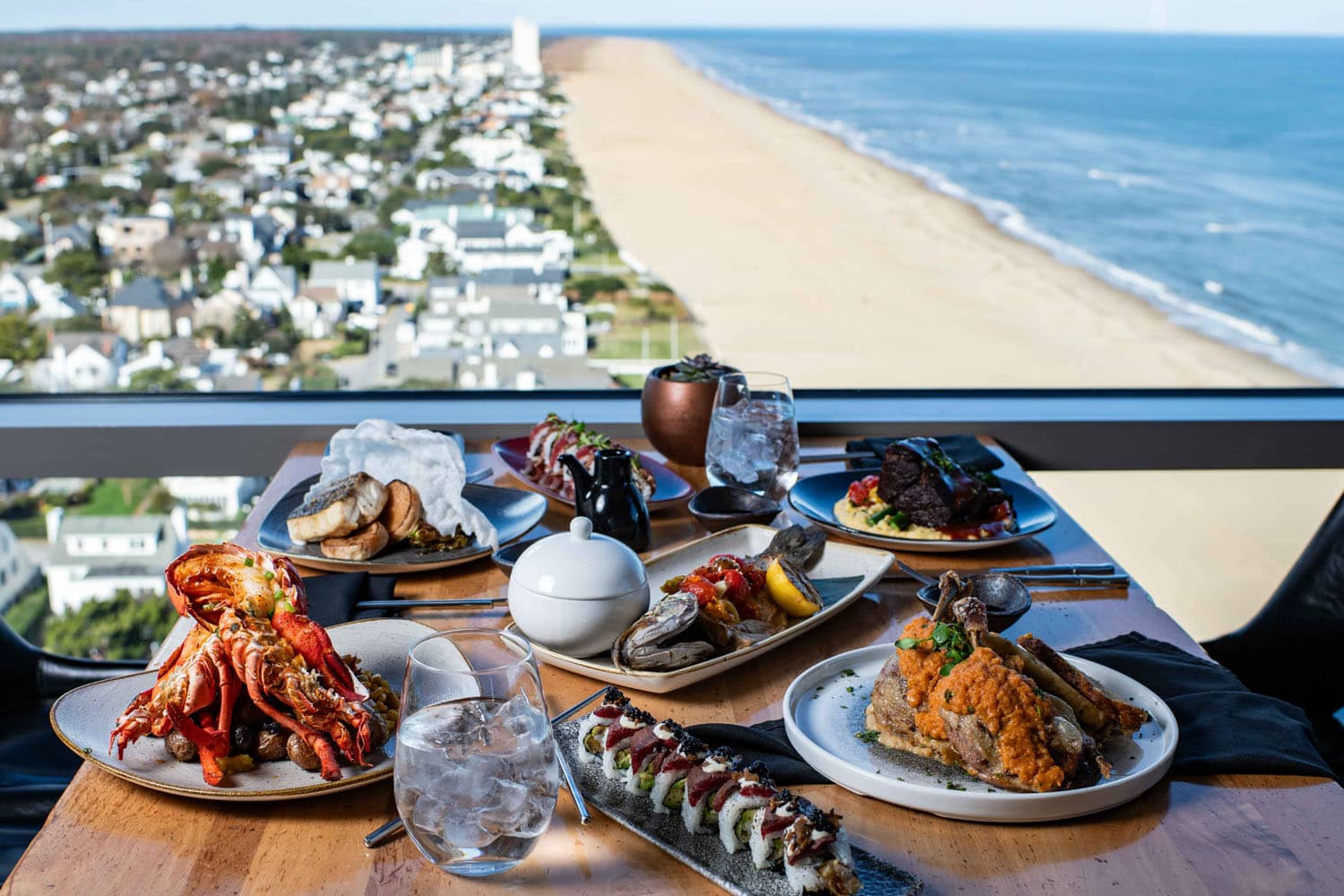 A table of plated dishes at Orion's Roof