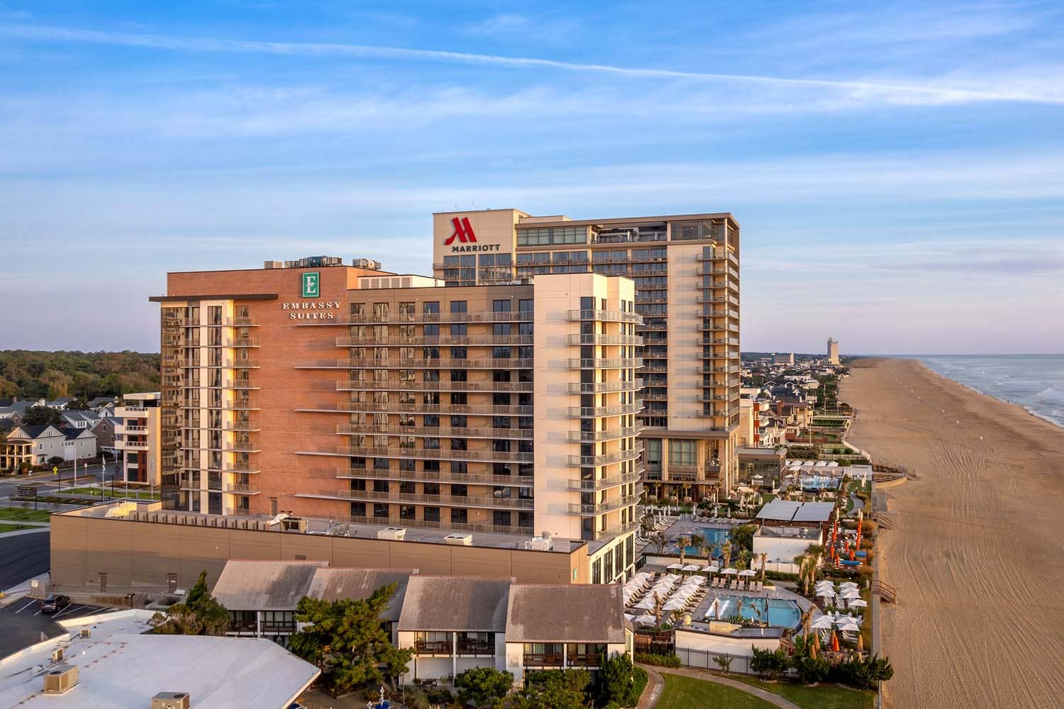 An oceanfront view of the Marriott and Embassy Suites hotels at the Cavalier Resort Virginia Beach