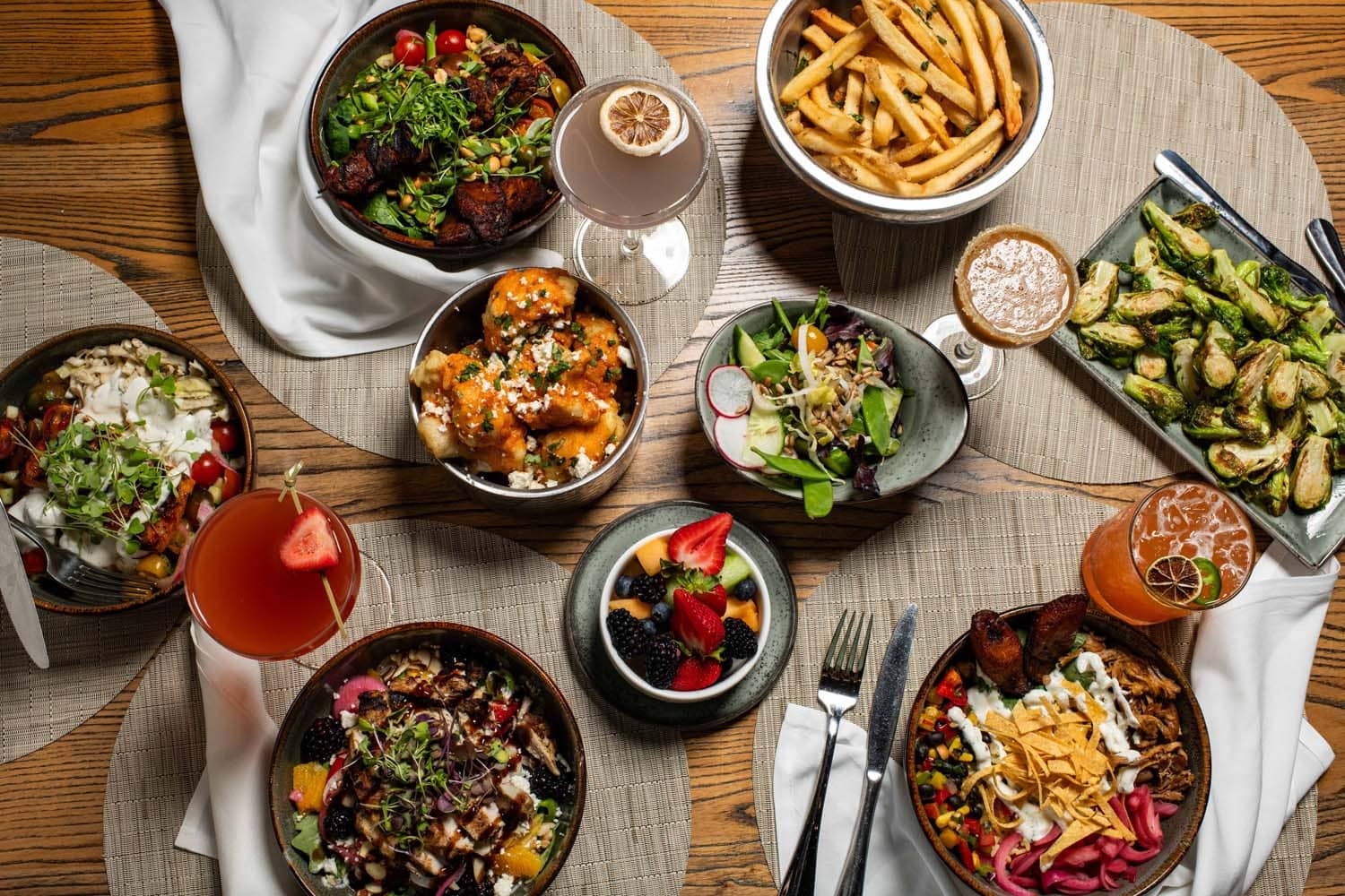 A variety of plated dishes on a table at Tulu Seaside Bar & Grill