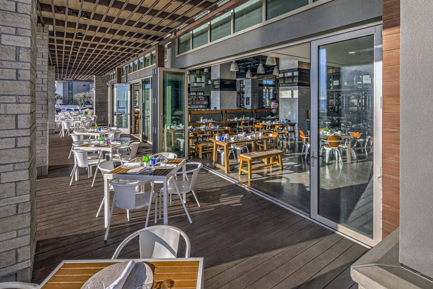 The outdoor patio and seating area outside Tulu Seaside Bar & Grill