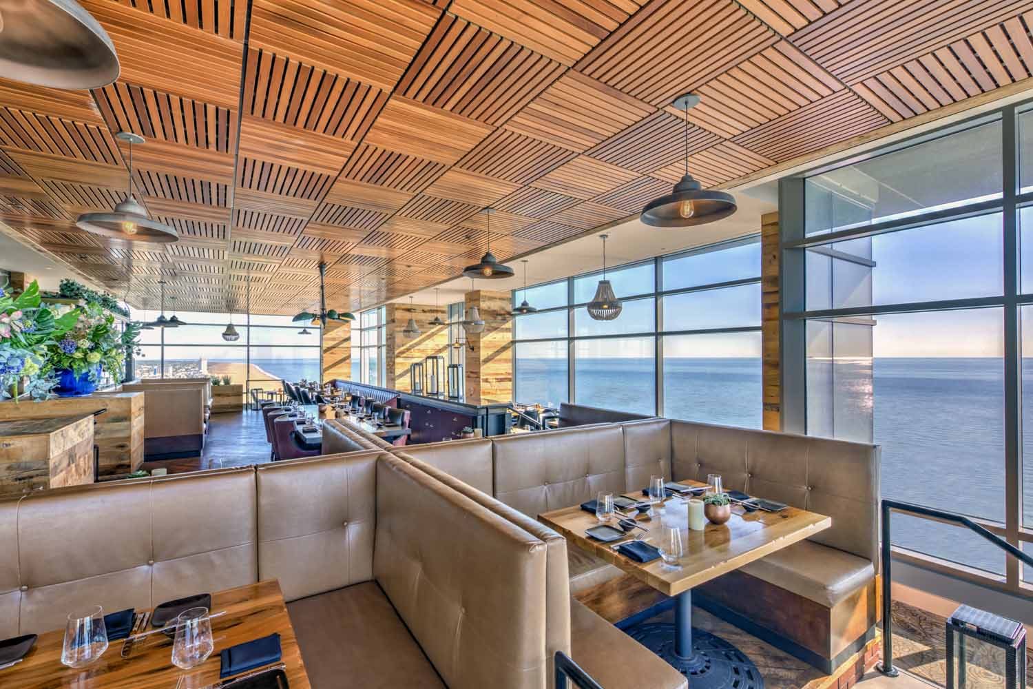 The interior dining with ocean views inside Orion's Roof restaurant