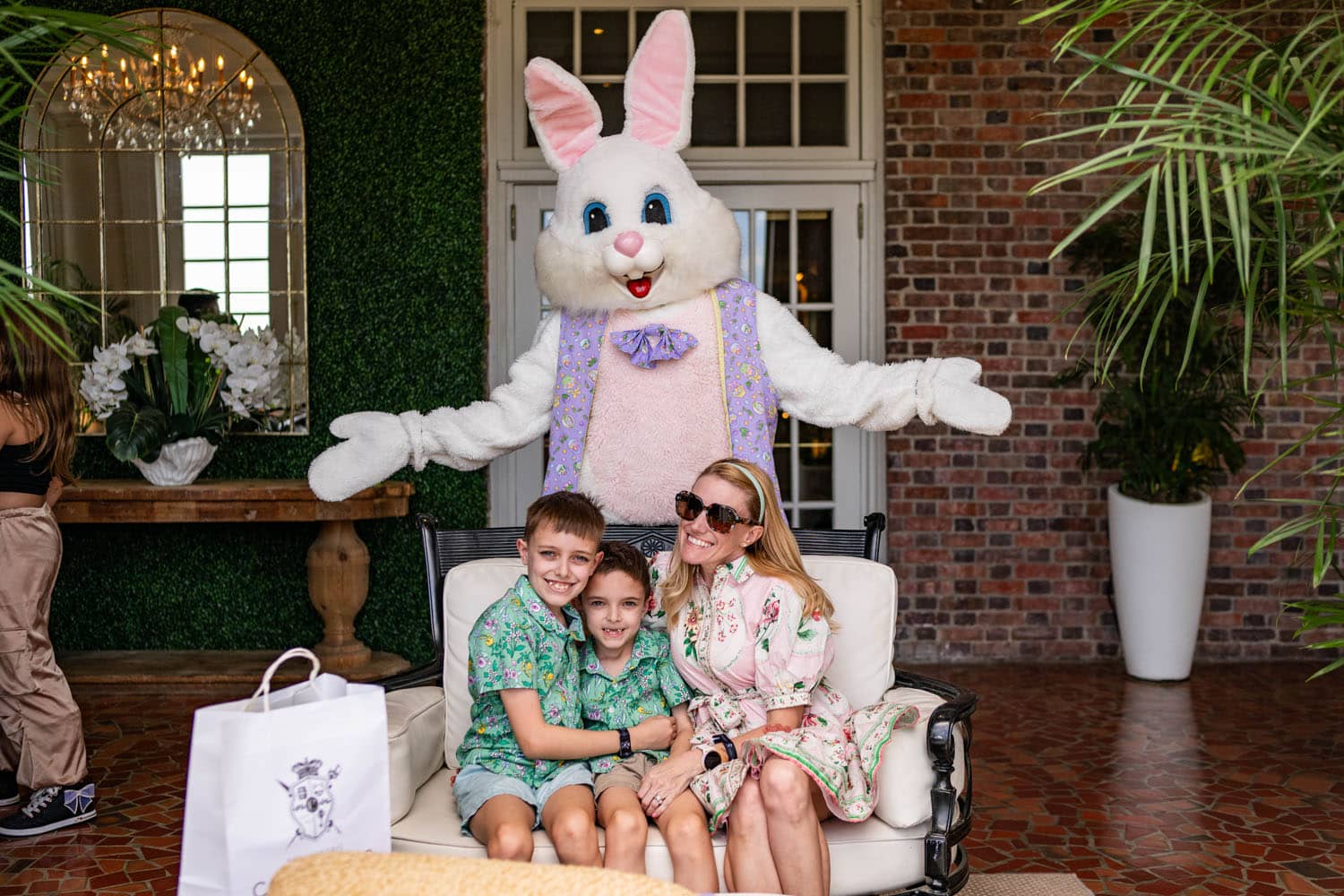 The Easter Bunny posing for photos with a family at The Historic Cavalier Hotel
