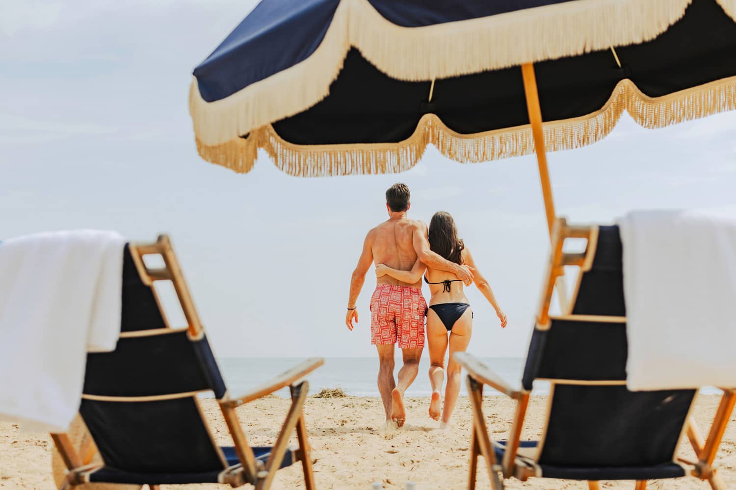 A couple enjoying the beach at the Cavalier Resort