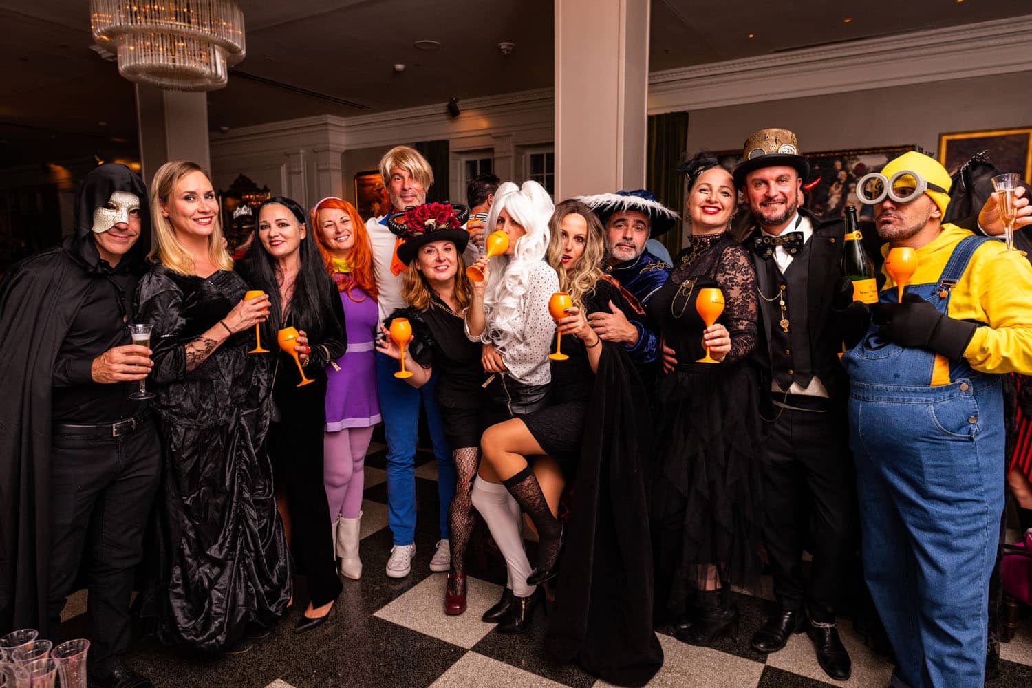 A group of guests dressed in costume for a Halloween party