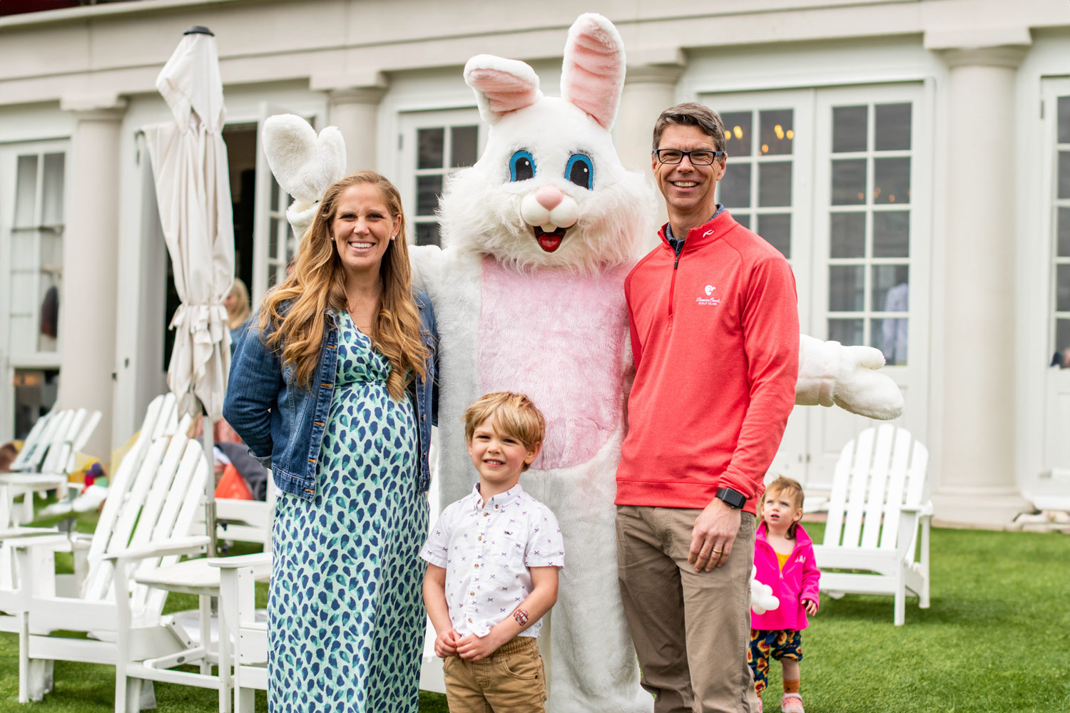A young family posing with the Easter Bunny at The Historic Cavalier Hotel