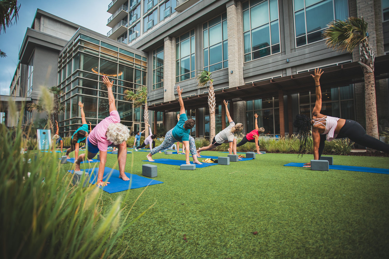 Yoga on the lawn outside the Embassy Suites by Hilton