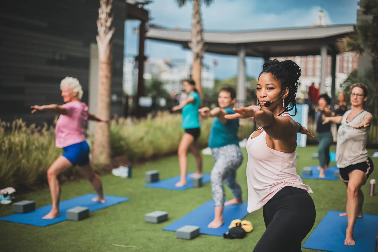 A yoga class held on the Ocean Lawn outside of the Marriott Virginia Beach Oceanfront Resort.