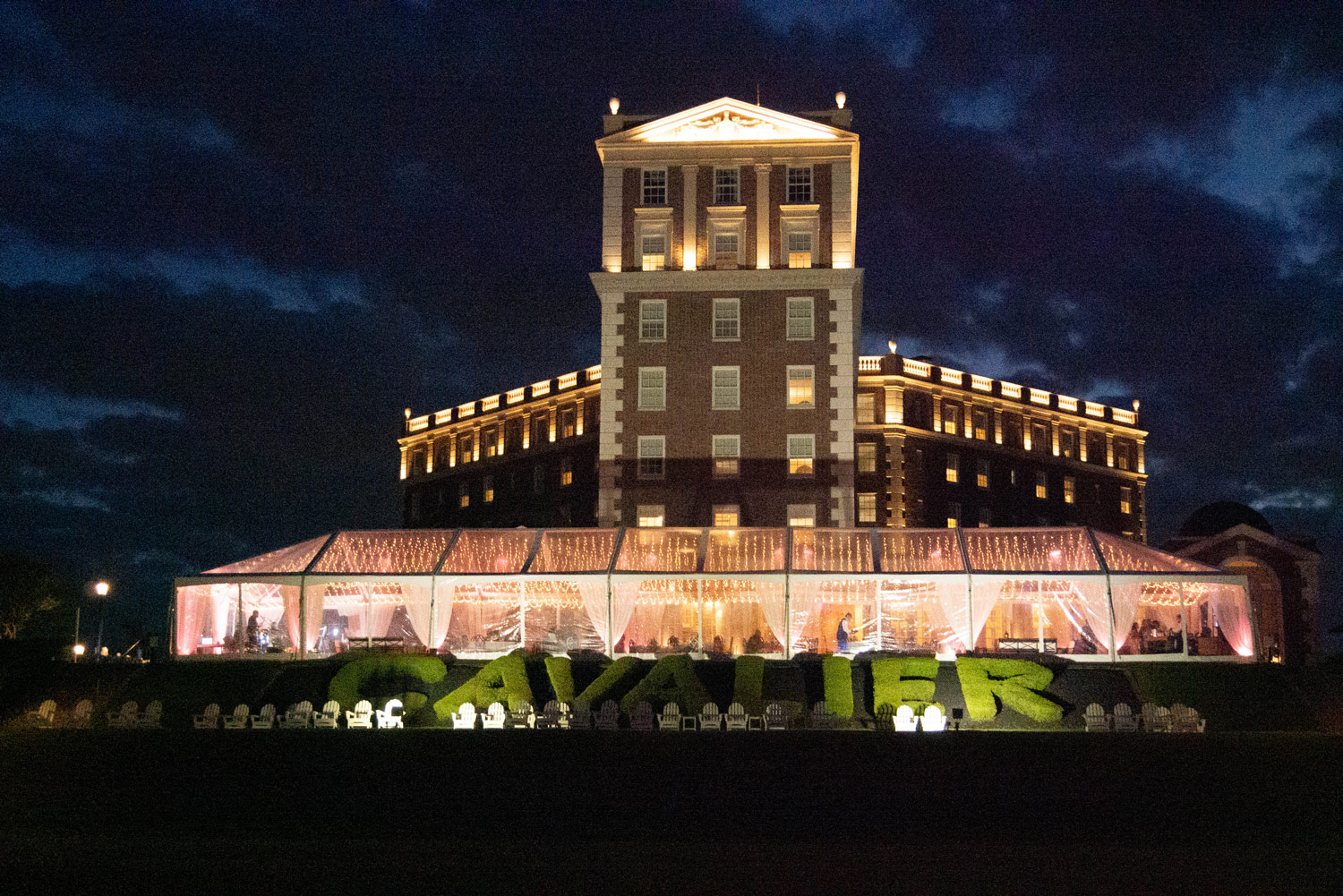 The Great Lawn of The Historic Cavalier Hotel set up for an event at night.
